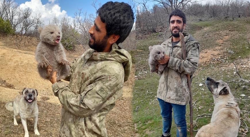 Köpeklerin saldırısından kurtardıkları yavru ayıyı doğaya saldılar